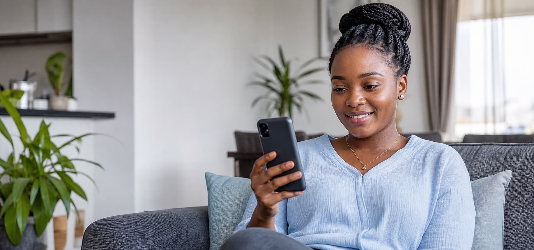 A woman using CherryHealth from home